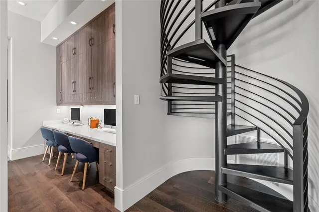 a view of a kitchen with a table and chairs