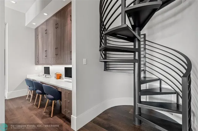 a view of a dining room with furniture and a potted plant