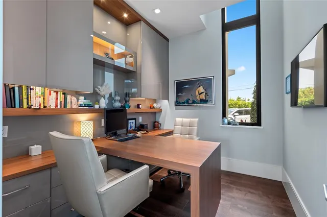 a view of a dining room with furniture and a potted plant