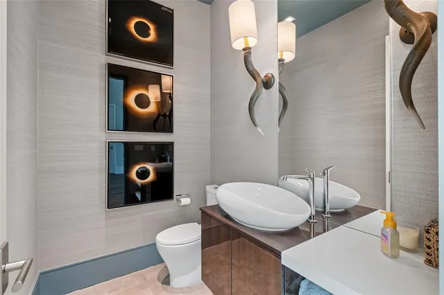 a bathroom with a toilet and a sink