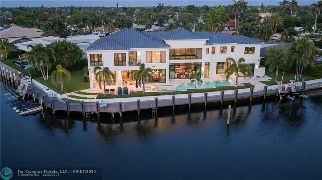 a view of a chairs and table on the wooden deck