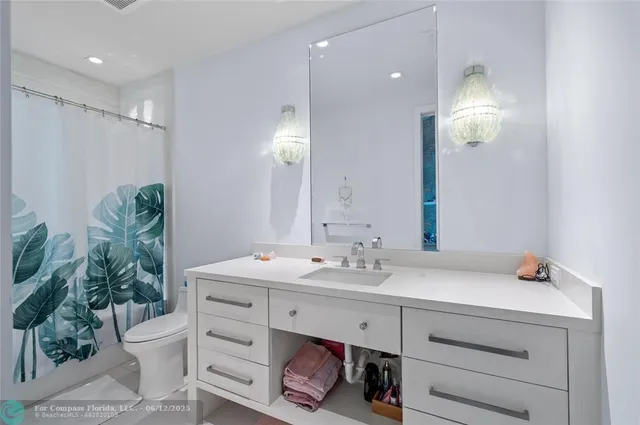 a view of a house with fountain and swimming pool