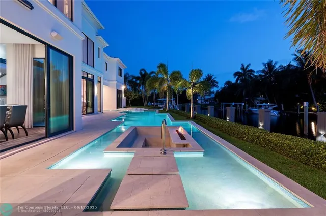 a view of swimming pool with a patio