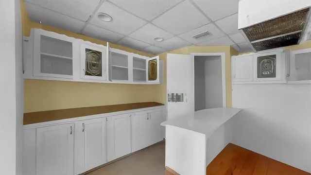 a hallway with cabinets