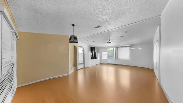 a view of a livingroom with wooden floor