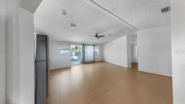 a view of a livingroom with wooden floor