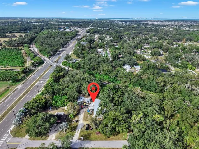 an aerial view of a houses with a street