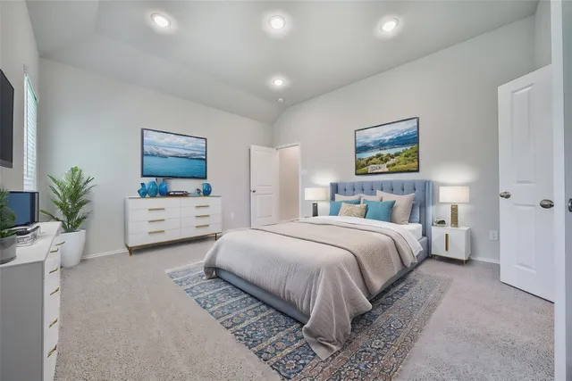 a bedroom with bed and a potted plant