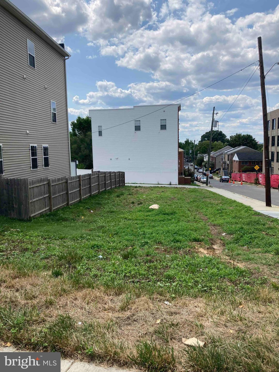 a view of a backyard with plants and a garden