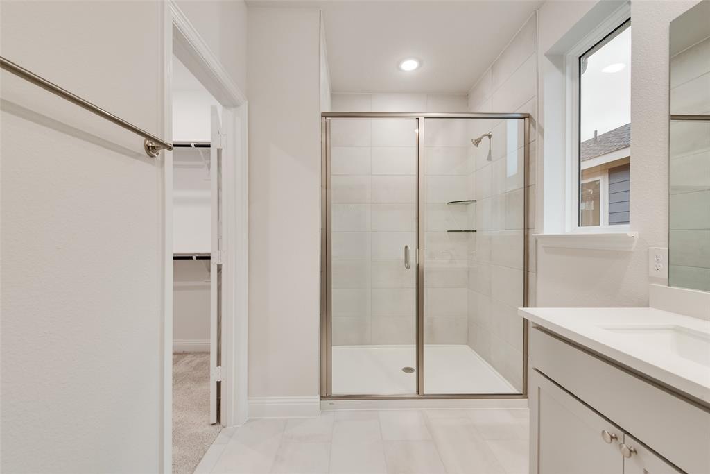 1013 Canoe Way Crowley, TX 76036 - Photo 18 of 26 a bathroom with a shower and a sink