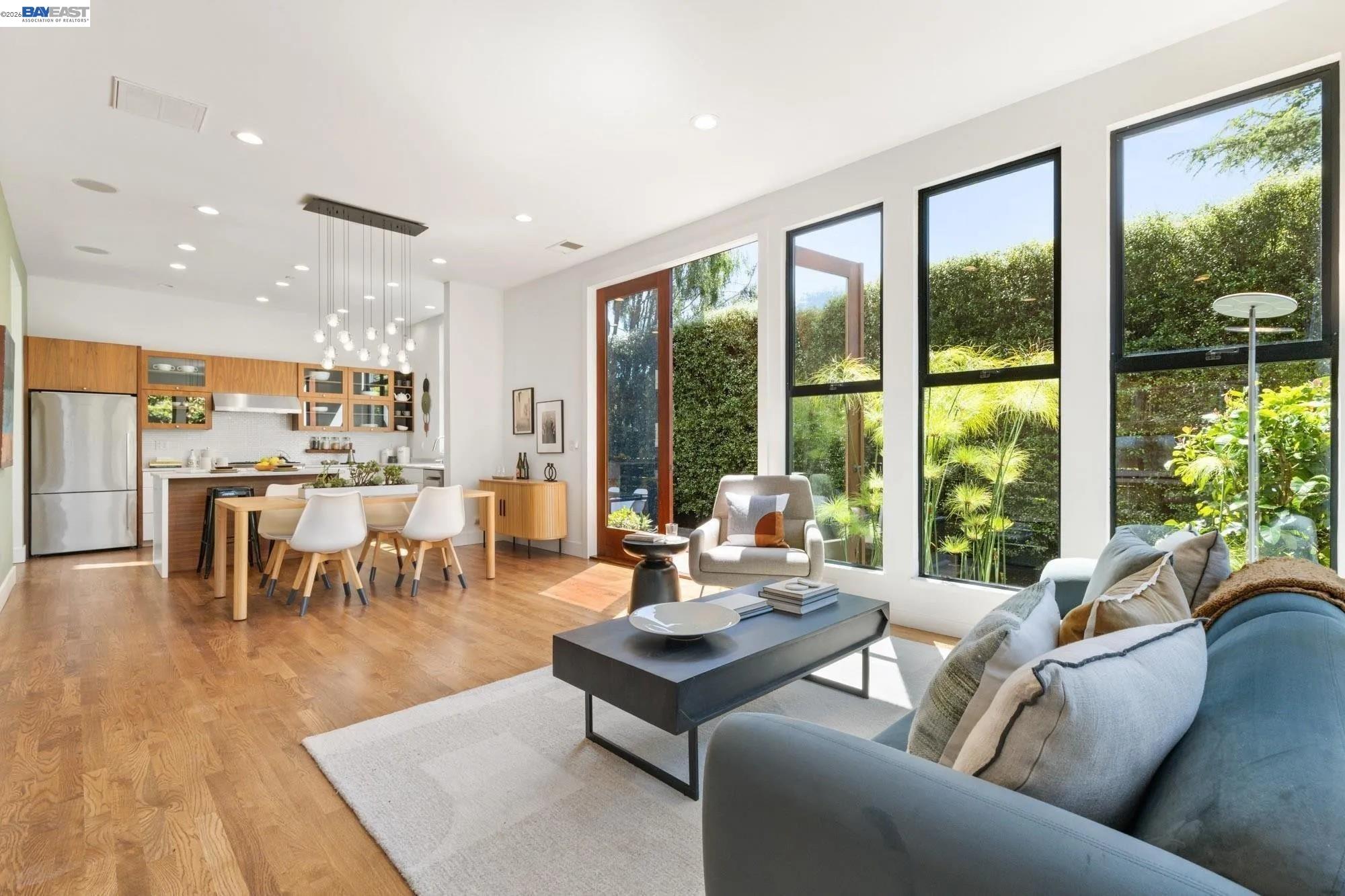 313 Spruce Street Alameda, CA 94501 - Photo 4 of 12 a living room with furniture wooden floor and a large window