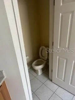 a white toilet sitting next to a sink