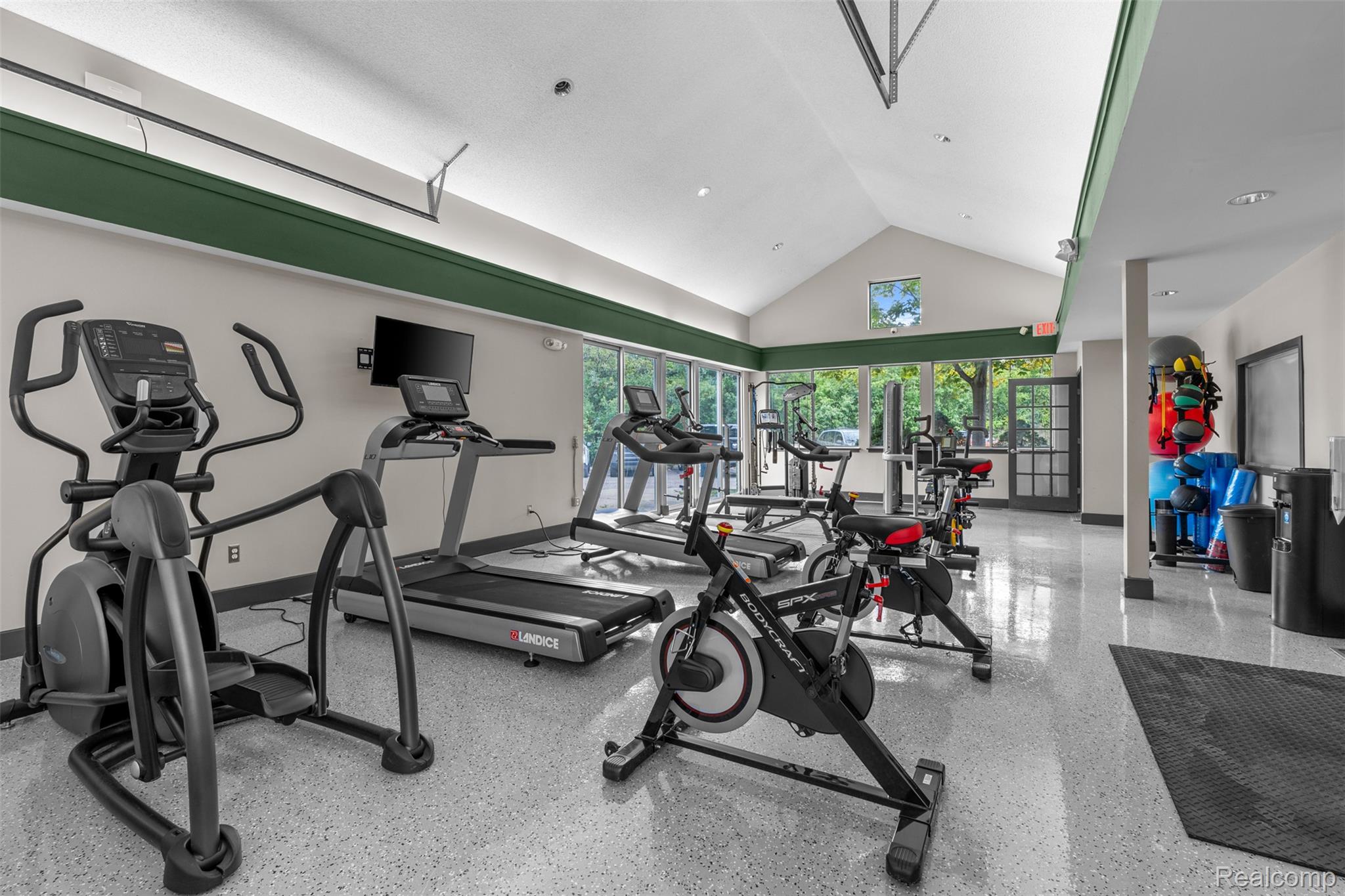 1050 North Adams Road, Unit 104 Birmingham, MI 48009 - Photo 5 of 16 Exercise room featuring a high ceiling