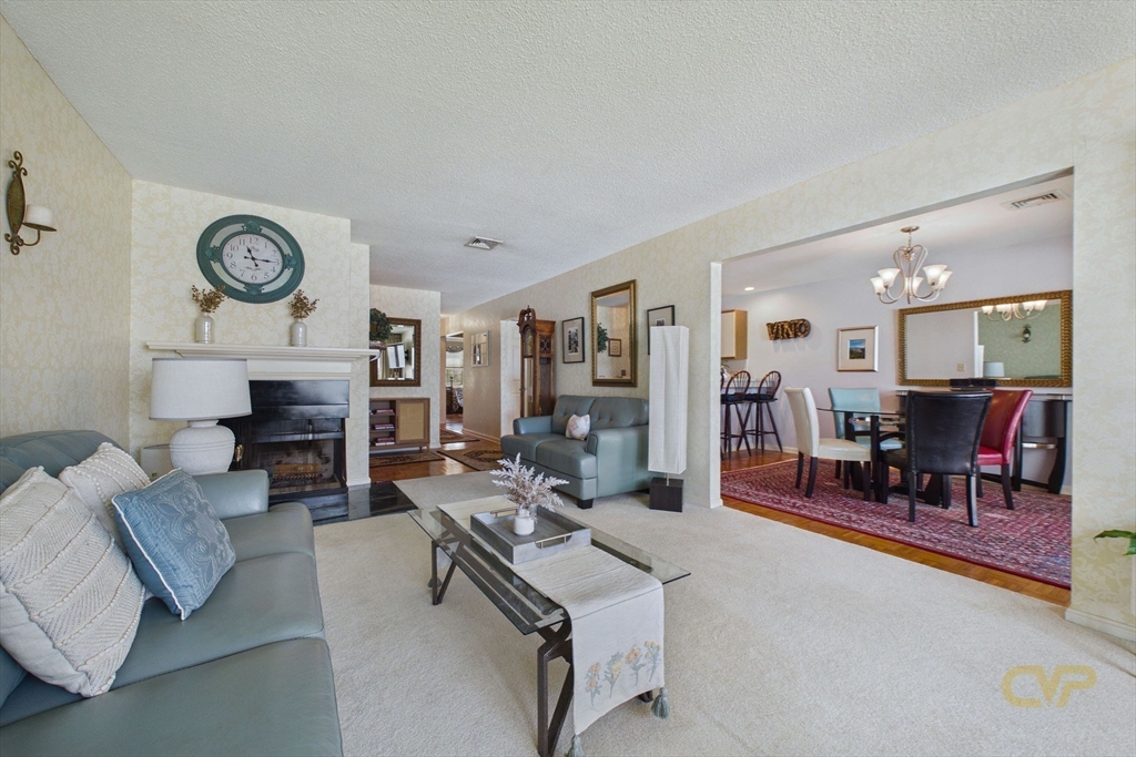 700 Shore Drive, Unit 509 Fall River, MA 02721 - Photo 10 of 25 a living room with furniture and a fireplace