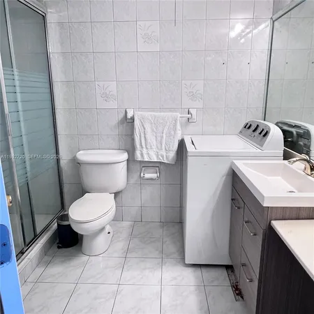 a bathroom with a sink and toilet