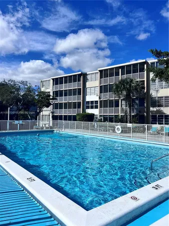 a view of building with yard