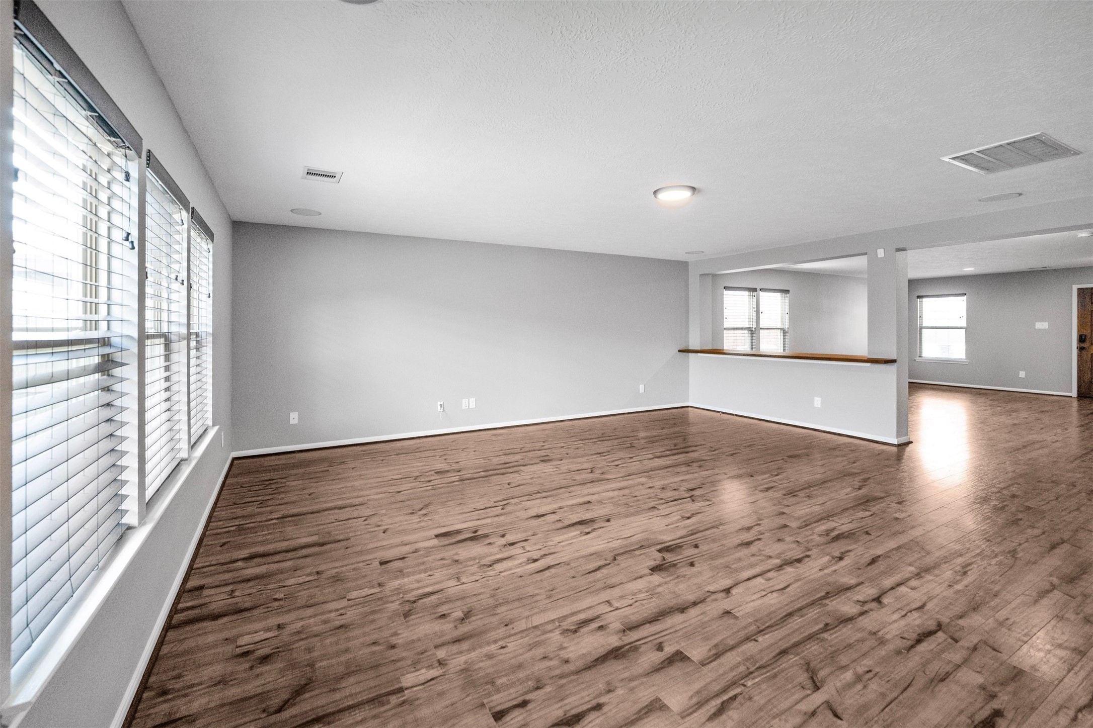 1107 Epworth Ct. Conroe, TX 77304 - Photo 14 of 38 wooden floor in an empty room with a window