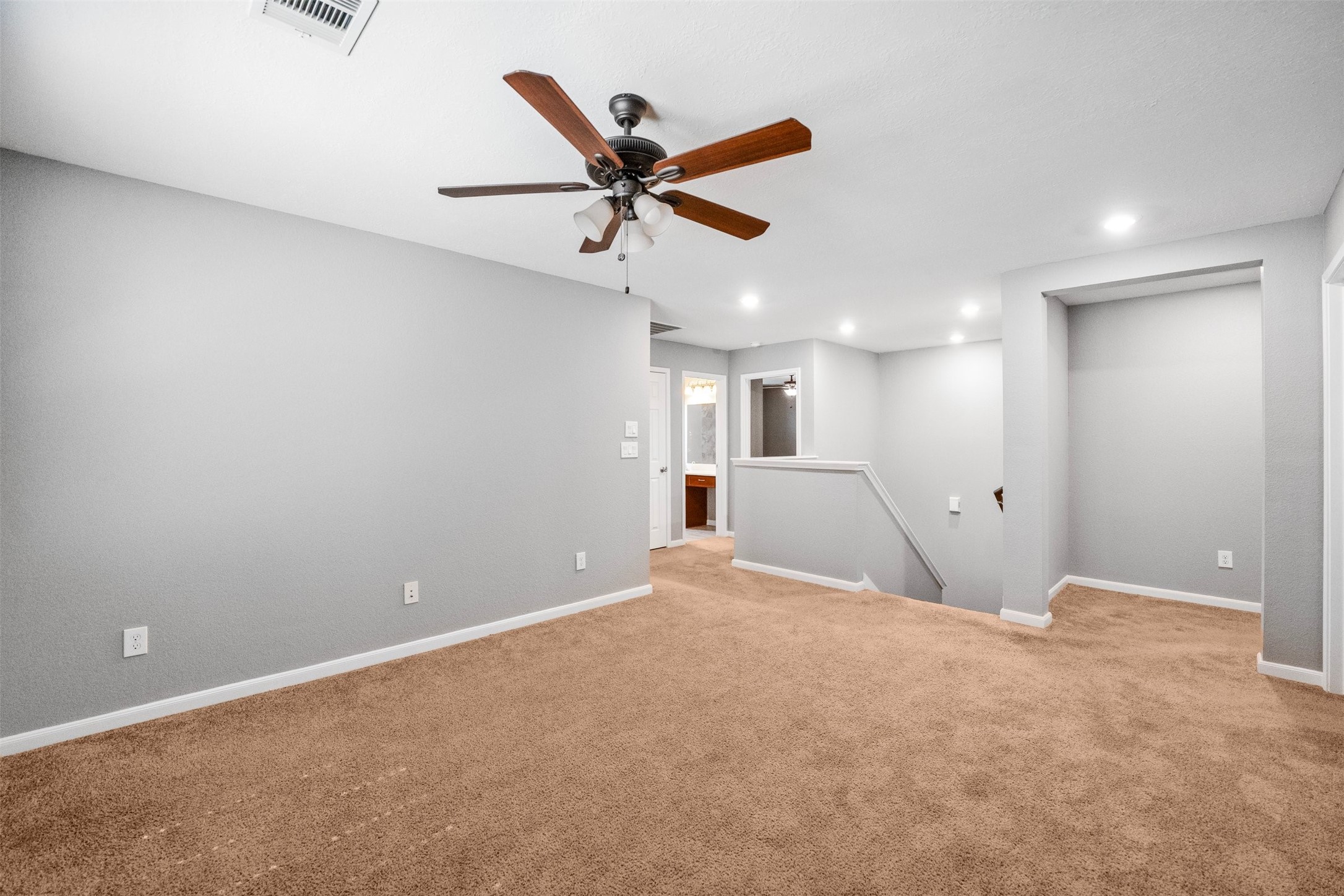 1107 Epworth Ct. Conroe, TX 77304 - Photo 21 of 38 a view of an empty room with a ceiling fan