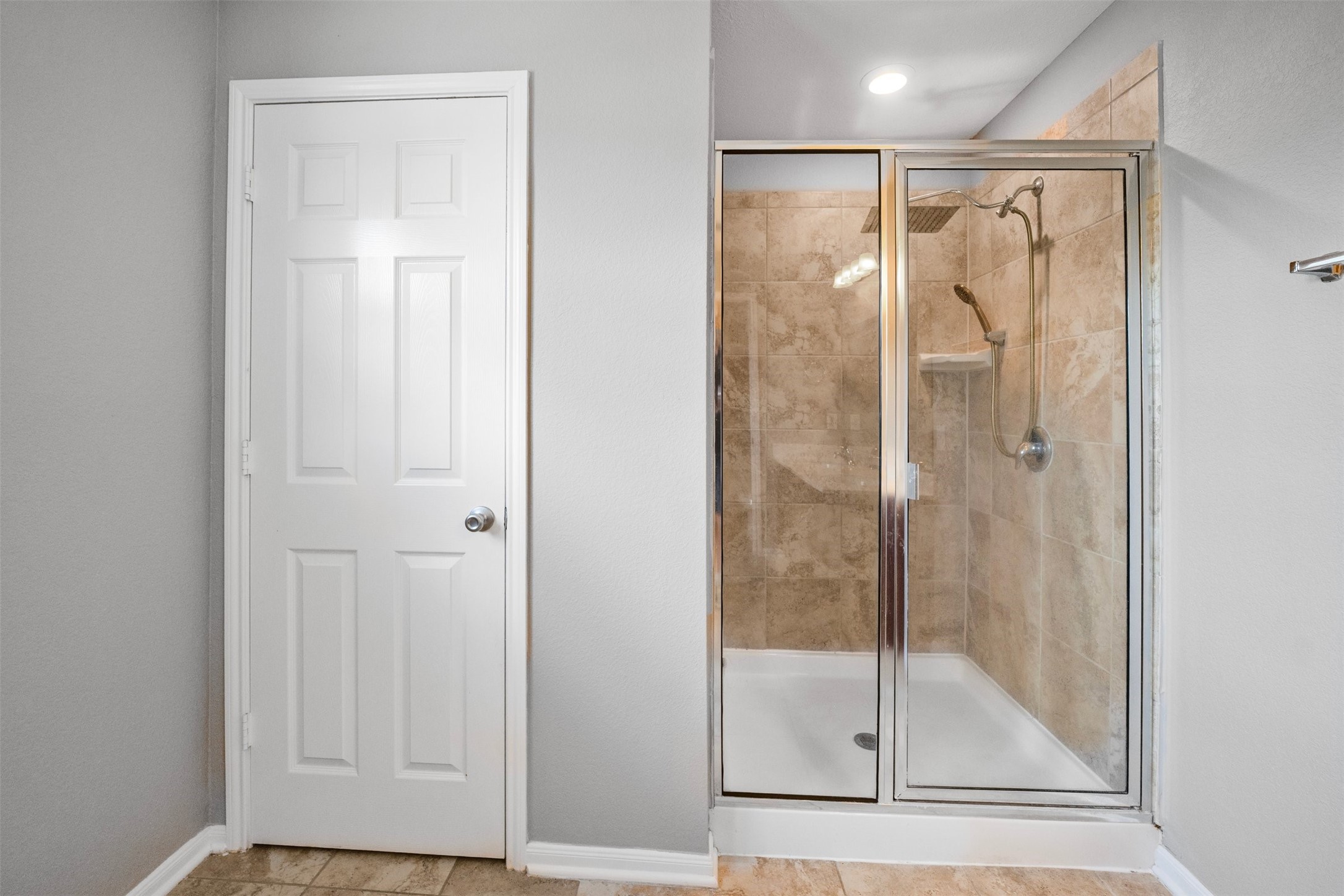 1107 Epworth Ct. Conroe, TX 77304 - Photo 25 of 38 a bathroom with a glass shower door