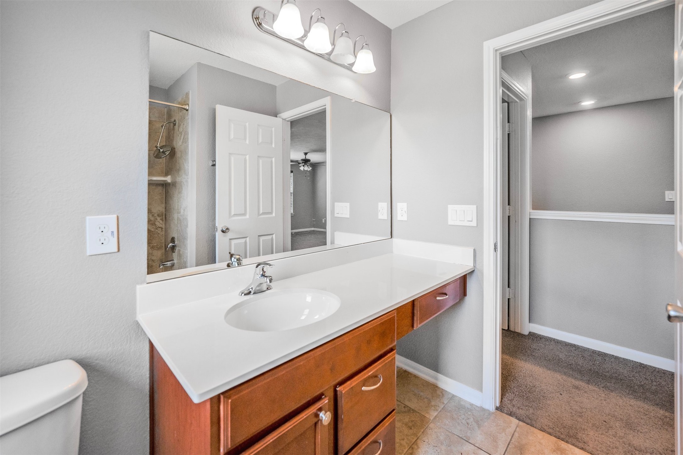 1107 Epworth Ct. Conroe, TX 77304 - Photo 31 of 38 a bathroom with a sink and a mirror