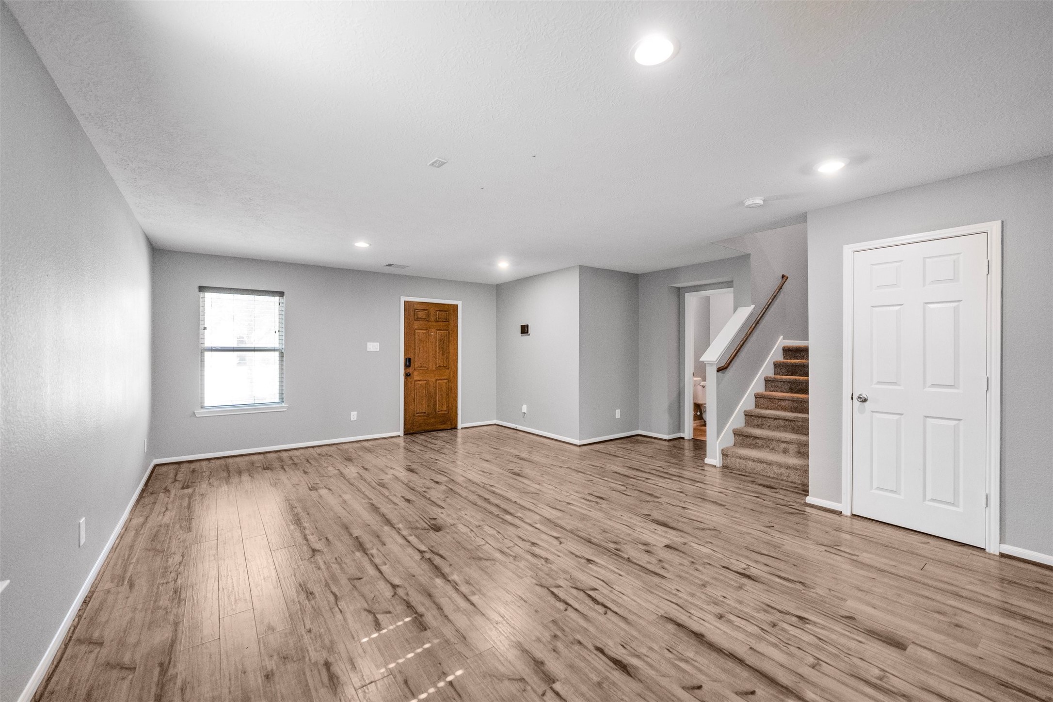 1107 Epworth Ct. Conroe, TX 77304 - Photo 8 of 38 a view of empty room with wooden floor and window