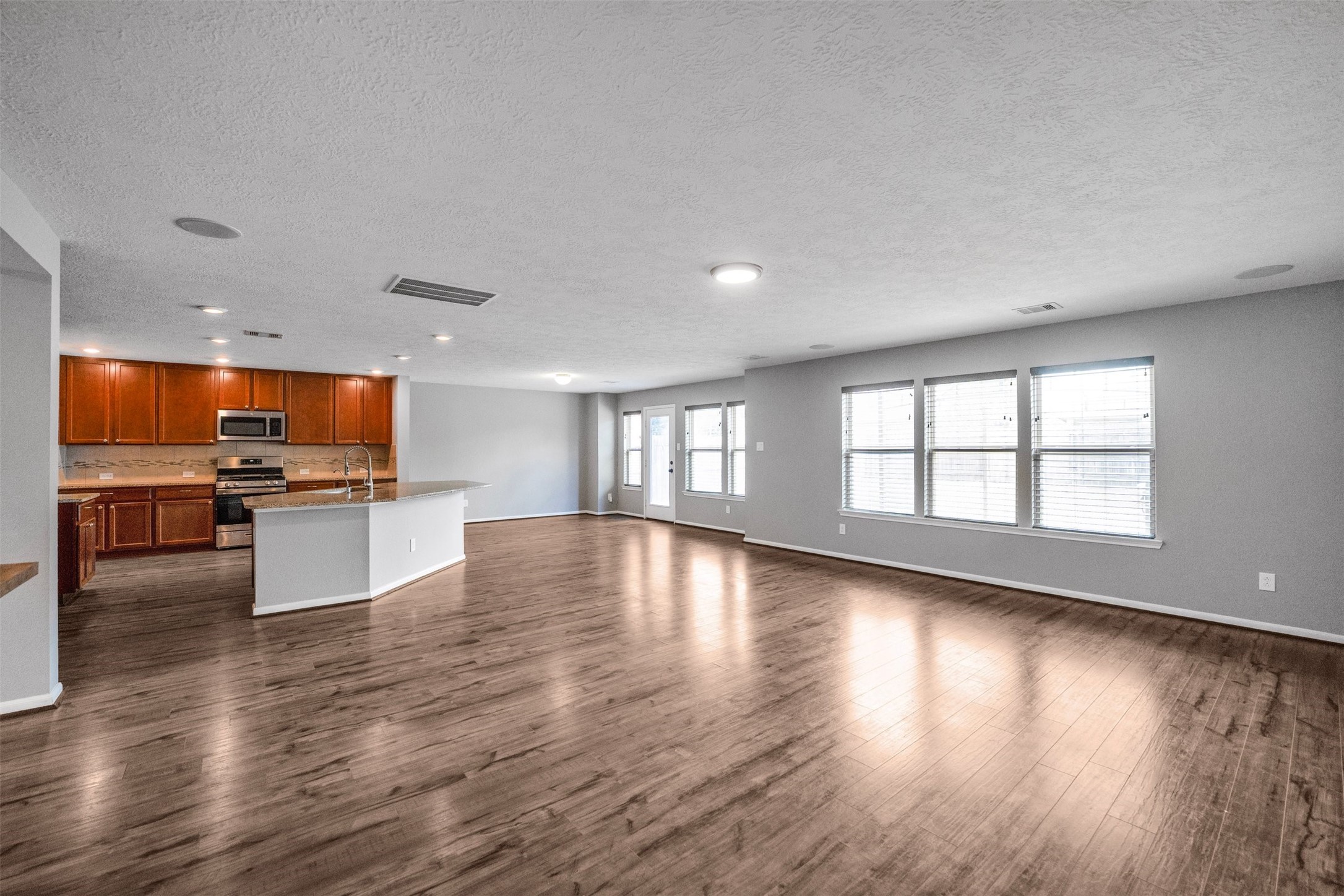 1107 Epworth Ct. Conroe, TX 77304 - Photo 10 of 38 a view of kitchen with a sink and a large window