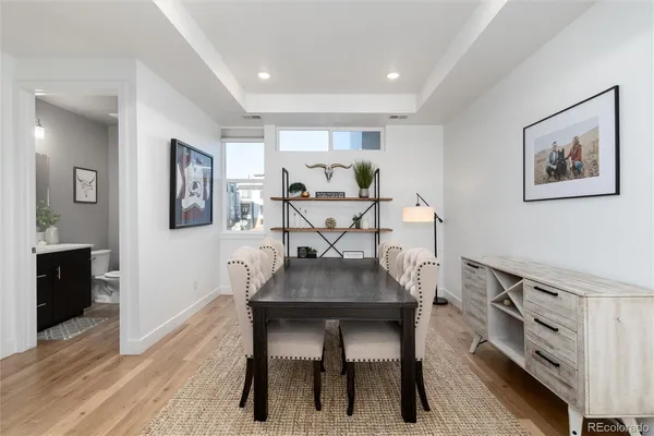 a view of a dining room with furniture and wooden floor