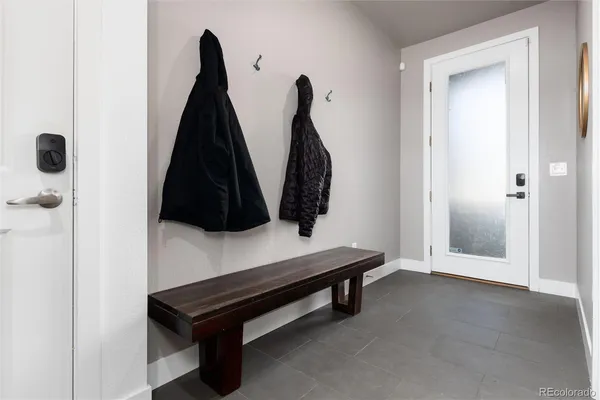 an empty room with wall painting and windows