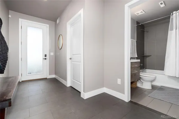 a bathroom with a sink a toilet and bathtub