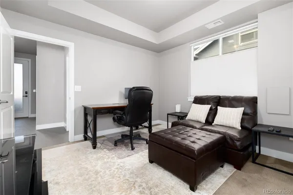 a bedroom with a bed and a chair