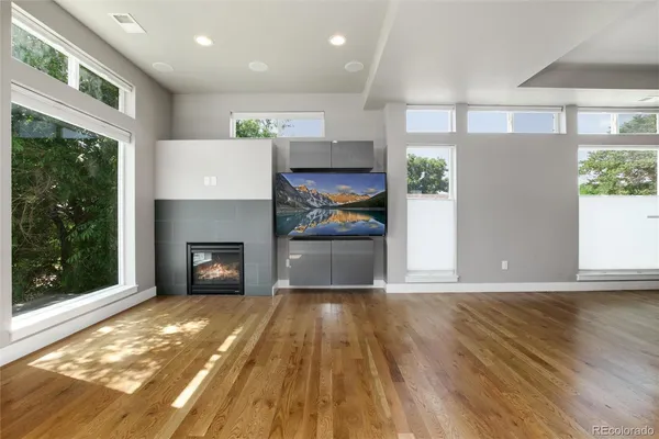 a view of a room with kitchen and fireplace
