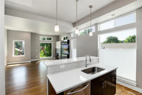 a view of kitchen with stainless steel appliances refrigerator and microwave