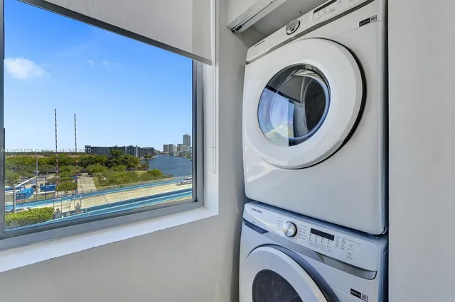 a view of storage and utility room with washer and dryer
