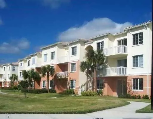 a front view of building with yard