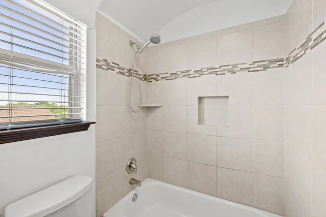 a bathroom with a shower and a bathtub
