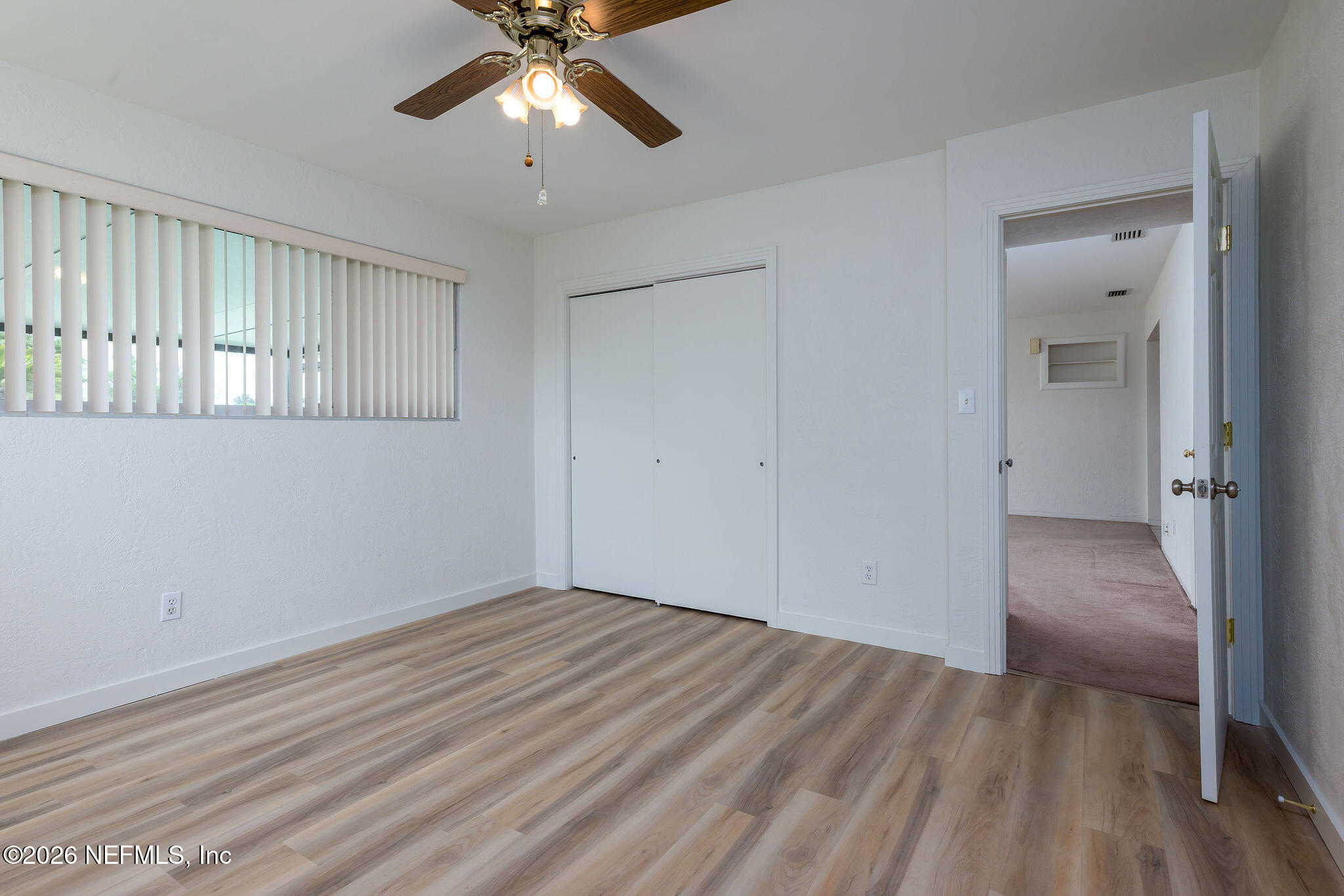 37 Berkley Road Ormond Beach, FL 32176 - Photo 21 of 33 a view of empty room with wooden floor and fan