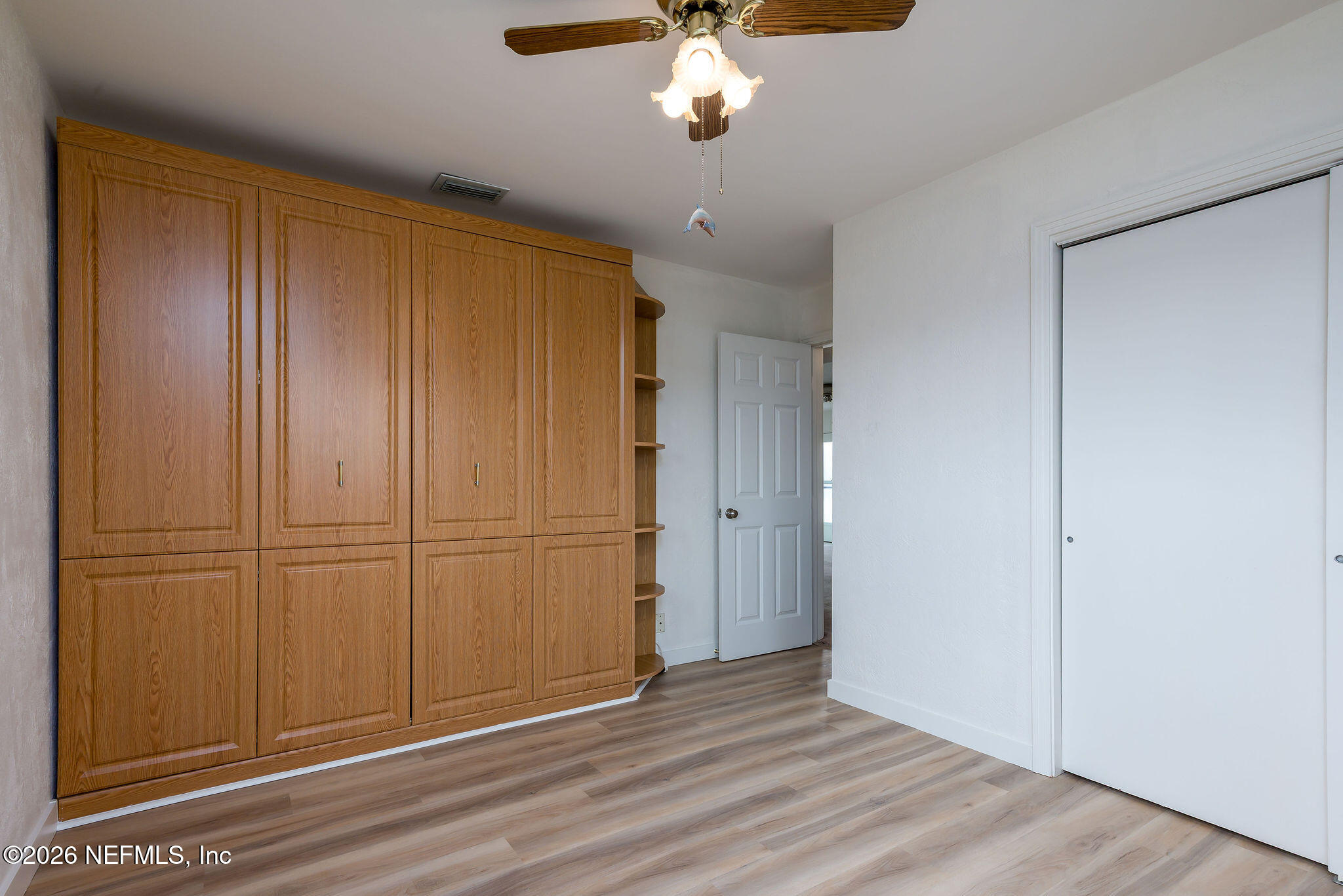37 Berkley Road Ormond Beach, FL 32176 - Photo 24 of 33 a view of an empty room with wooden floor