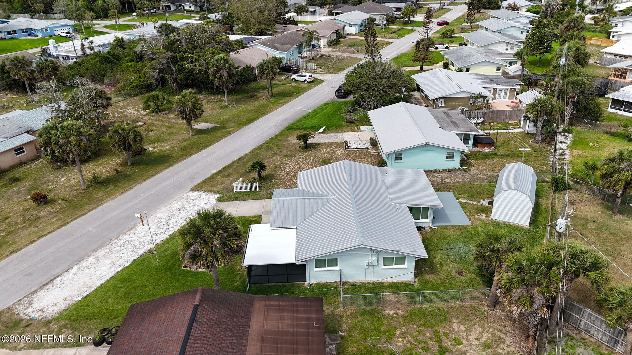 37 Berkley Road Ormond Beach, FL 32176 - Photo 28 of 33 a aerial view of a house with a garden and lake view