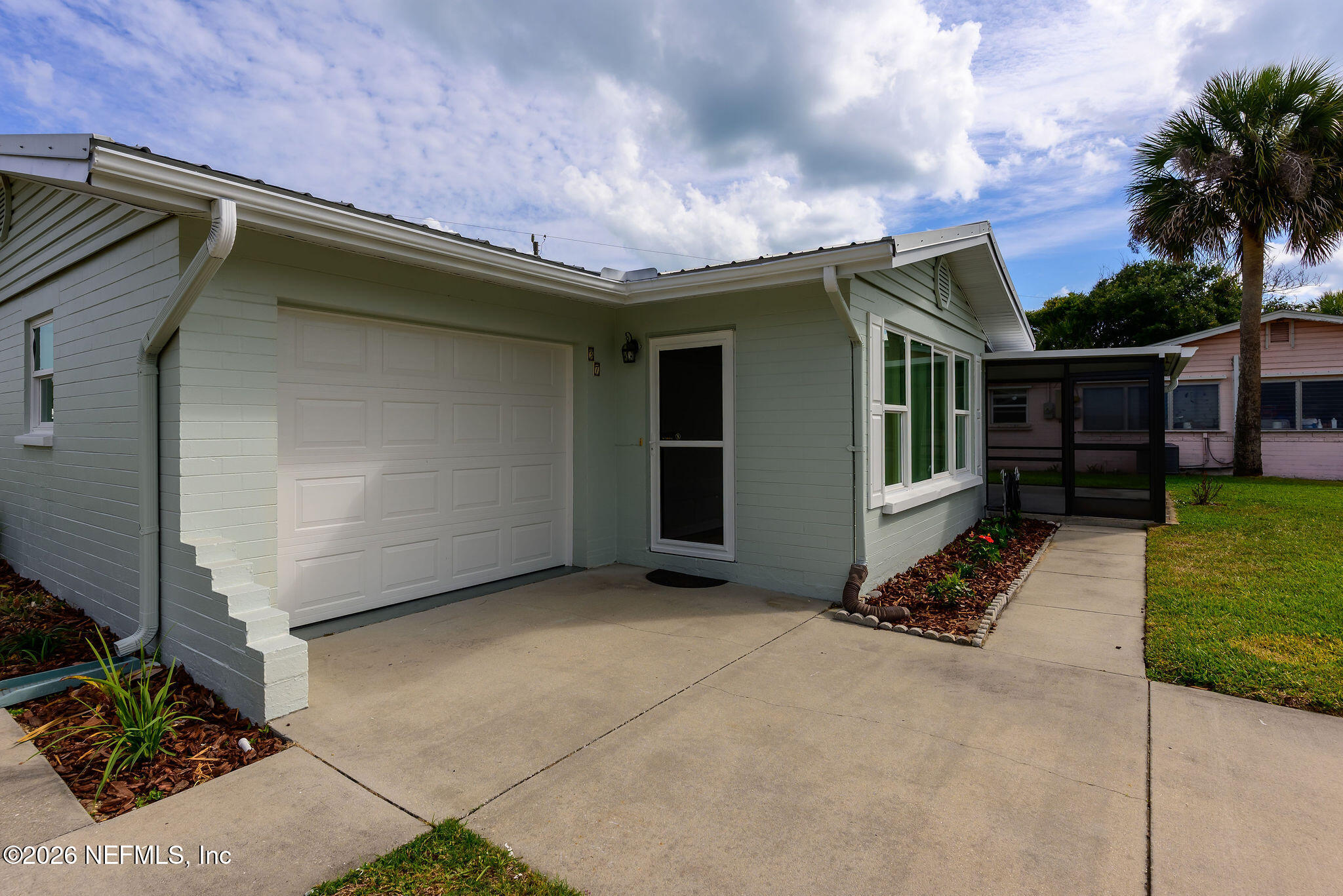 37 Berkley Road Ormond Beach, FL 32176 - Photo 3 of 33 a view of a house with a yard and potted plants