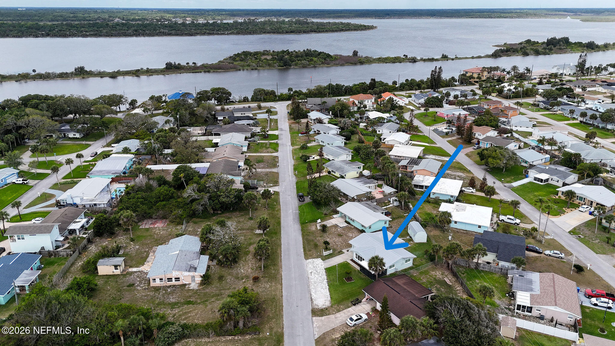 37 Berkley Road Ormond Beach, FL 32176 - Photo 32 of 33 an aerial view of city and lake with trees all around