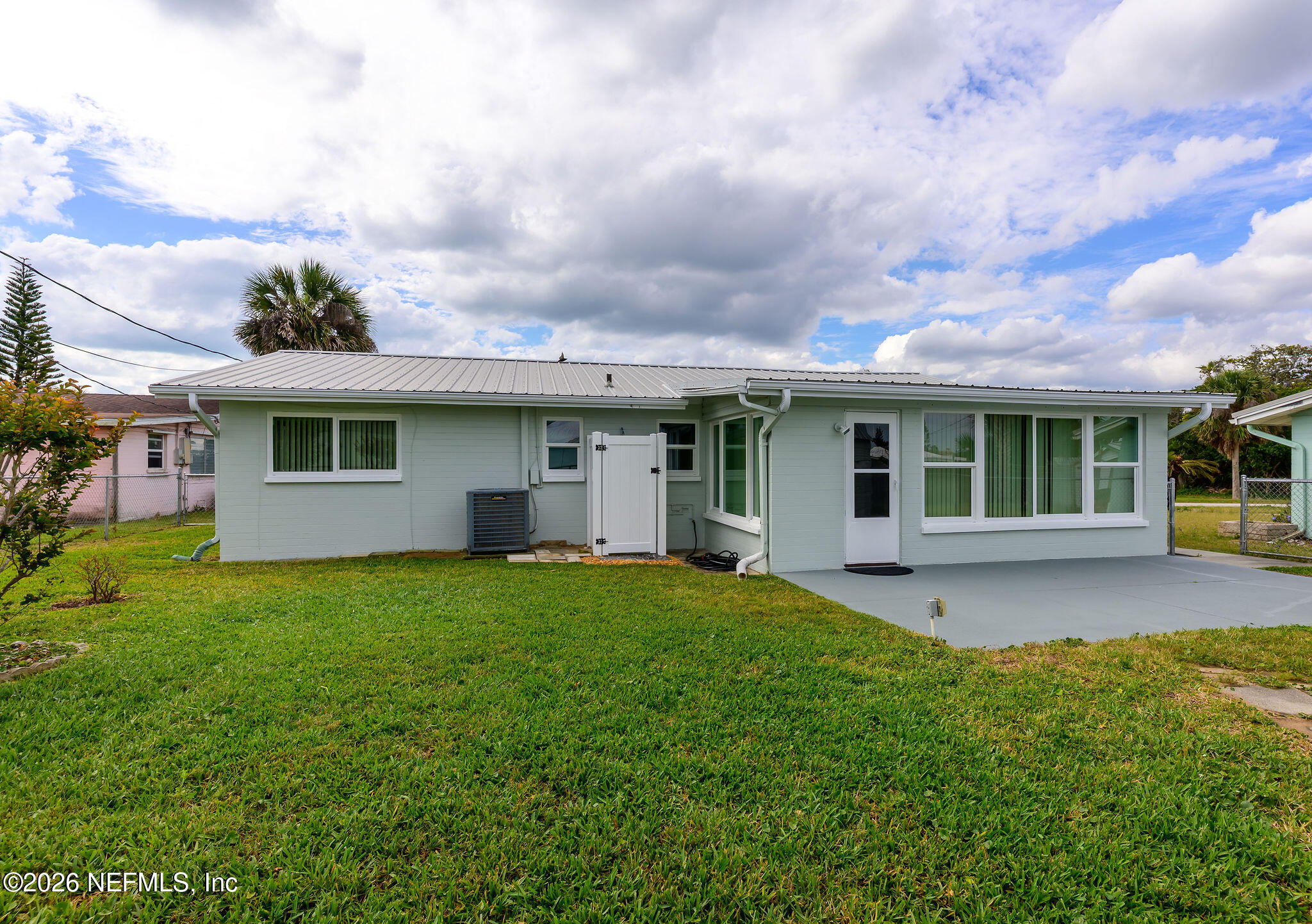 37 Berkley Road Ormond Beach, FL 32176 - Photo 10 of 33 a front view of a house with a garden
