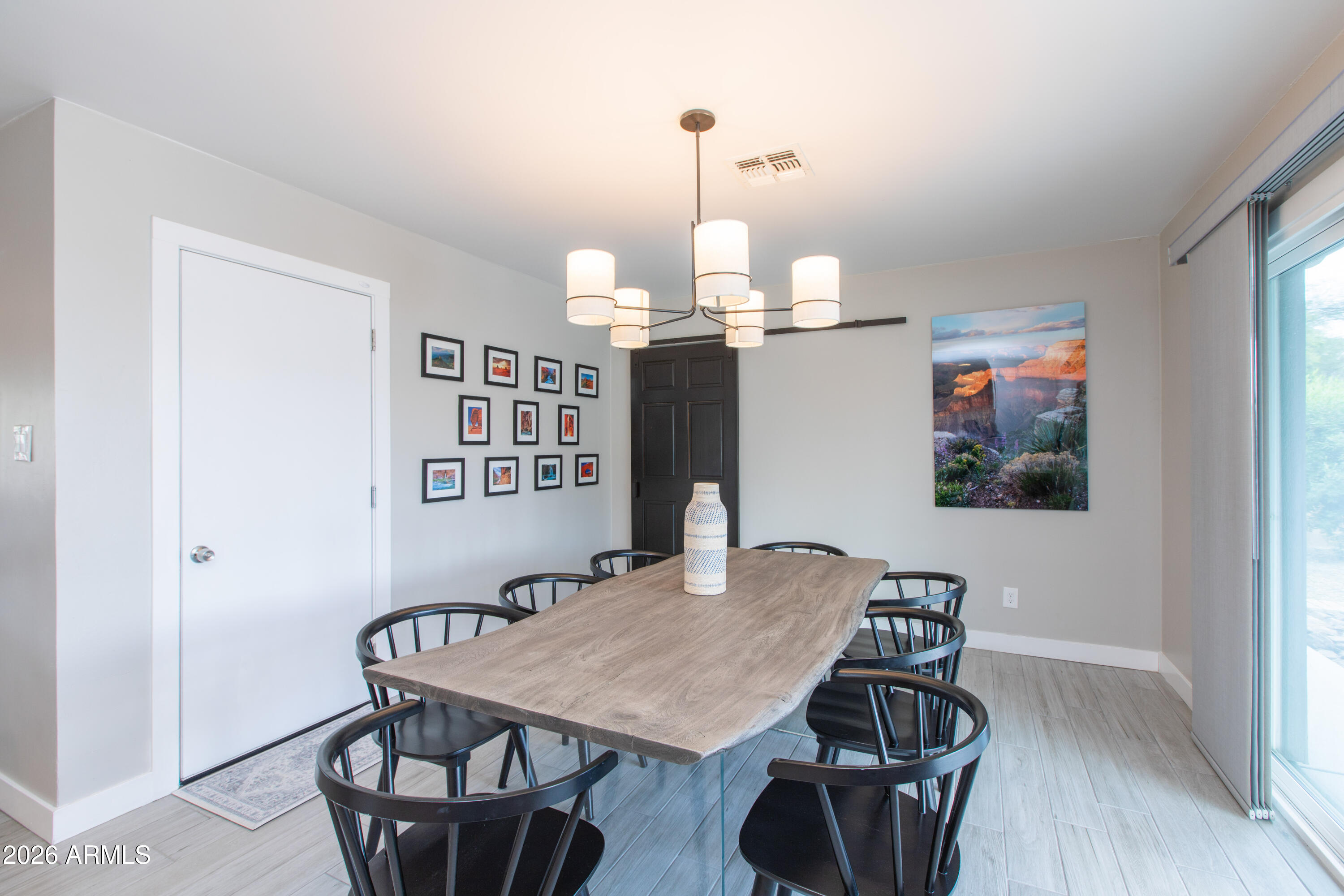 5541 East Cheery Lynn Road Phoenix, AZ 85018 - Photo 24 of 69 a view of a dining room with furniture and wooden floor