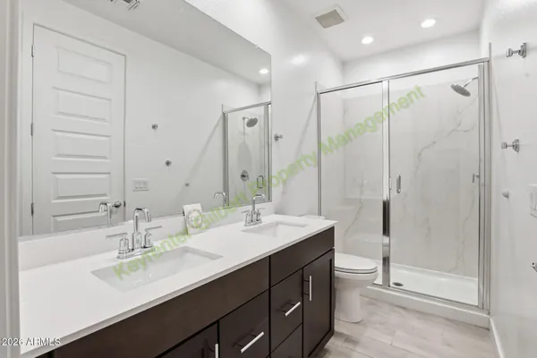 a front view of a house with patio and garden