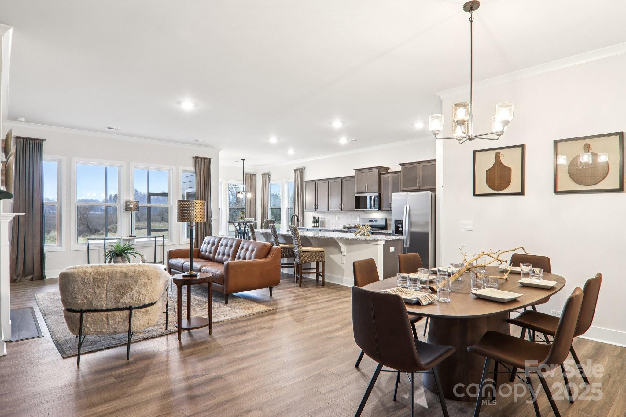 623 River Btm Road Fletcher, NC 28732 - Photo 15 of 48 a dining room with furniture a chandelier and wooden floor