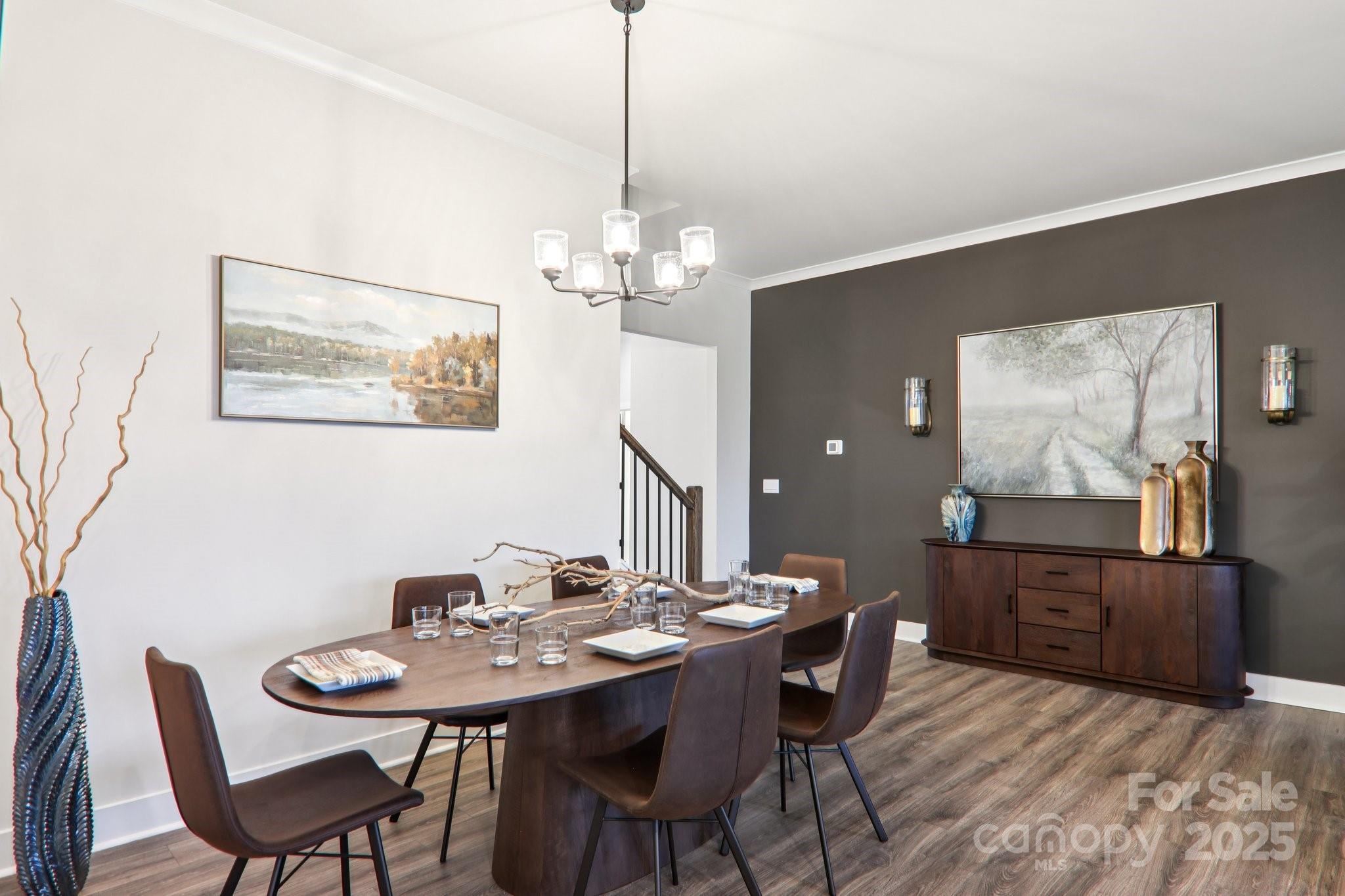 623 River Btm Road Fletcher, NC 28732 - Photo 17 of 48 a view of a dining room with furniture and wooden floor