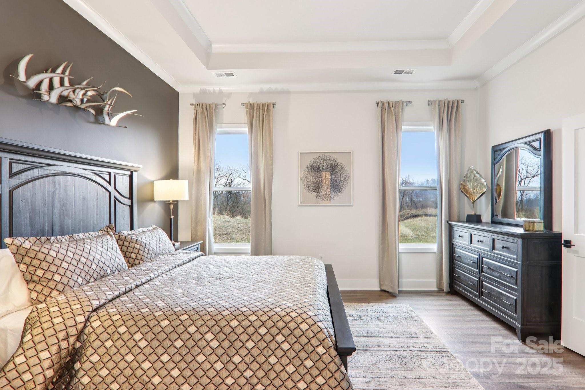 623 River Btm Road Fletcher, NC 28732 - Photo 19 of 48 a bedroom with a large bed and a dresser