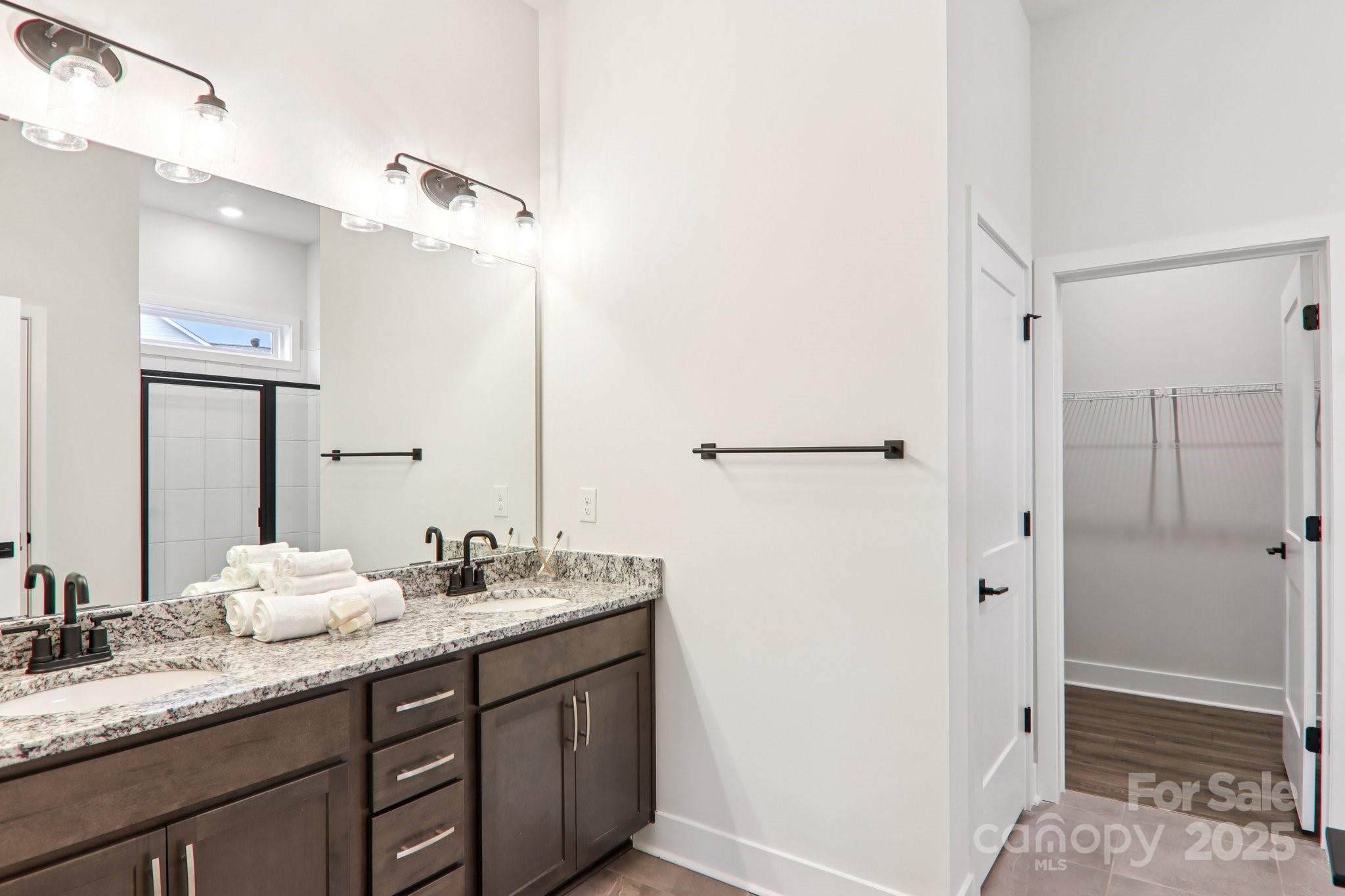 623 River Btm Road Fletcher, NC 28732 - Photo 22 of 48 a bathroom with a granite countertop sink mirror and double