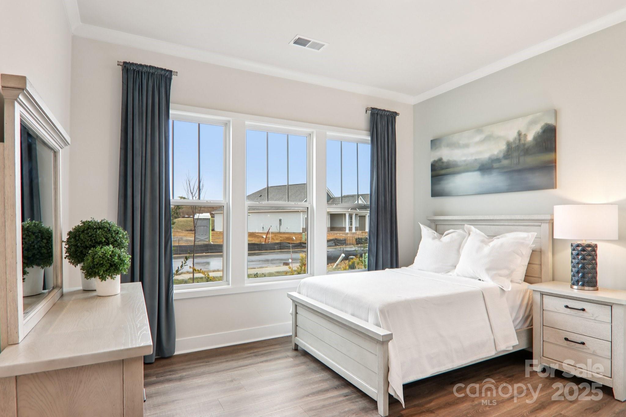 623 River Btm Road Fletcher, NC 28732 - Photo 26 of 48 a bedroom with a large bed and a potted plant