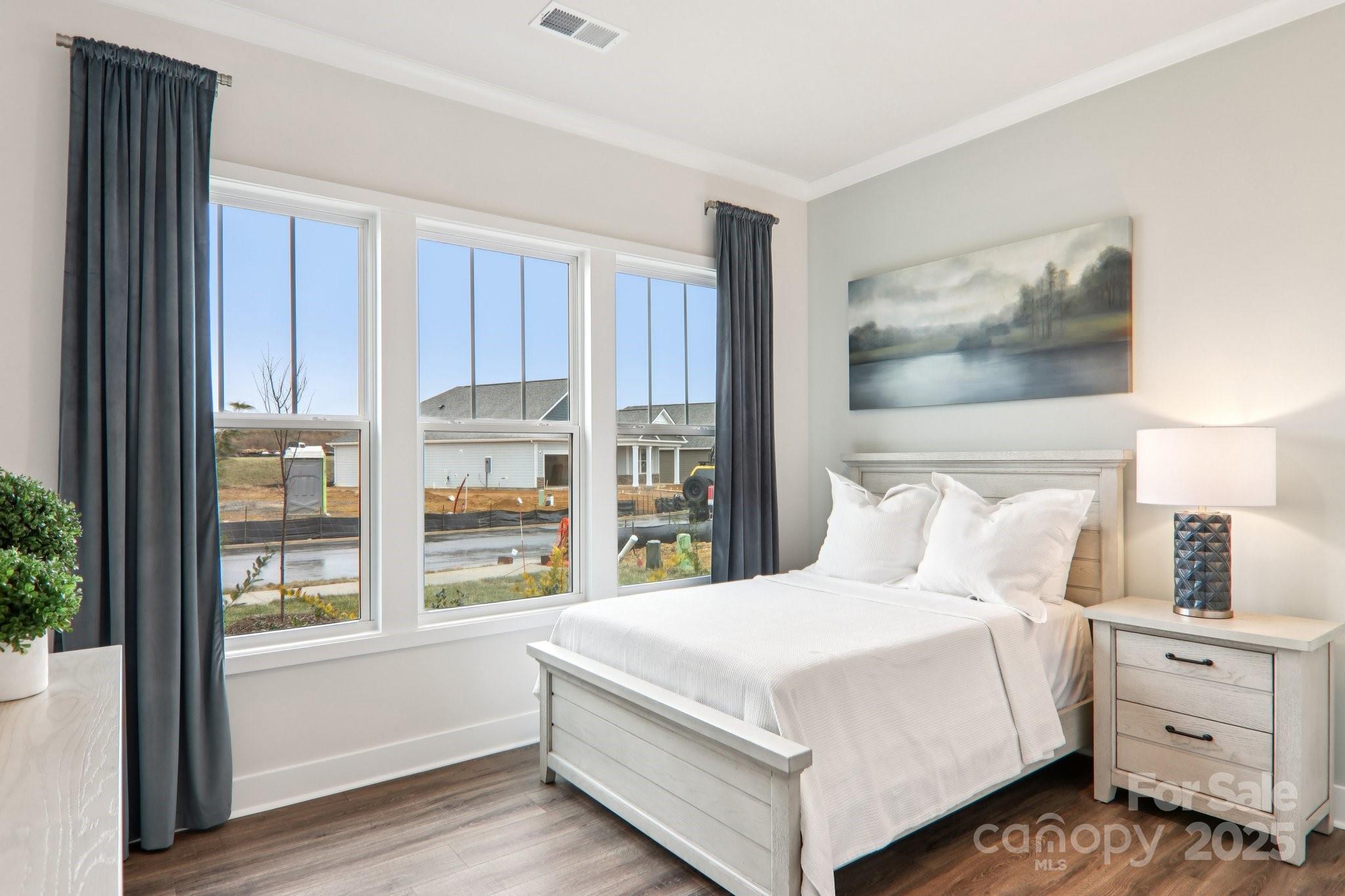 623 River Btm Road Fletcher, NC 28732 - Photo 27 of 48 a bedroom with a large bed and a window