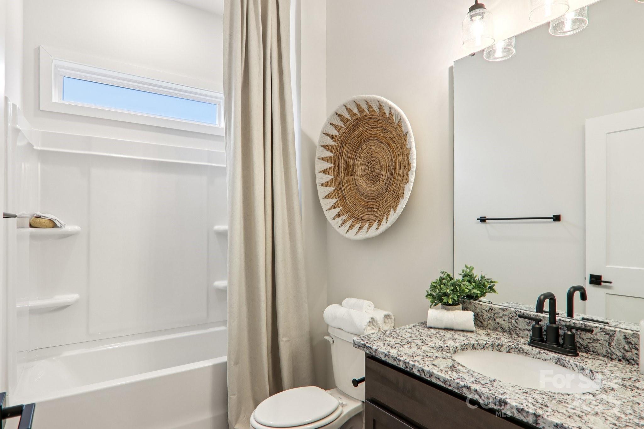 623 River Btm Road Fletcher, NC 28732 - Photo 29 of 48 a bathroom with a granite countertop sink and a mirror